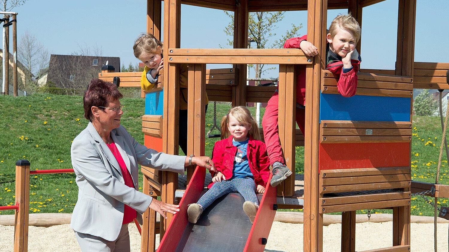 Kindergarten of company Company founder Dr Ute Bergner with children in the playground